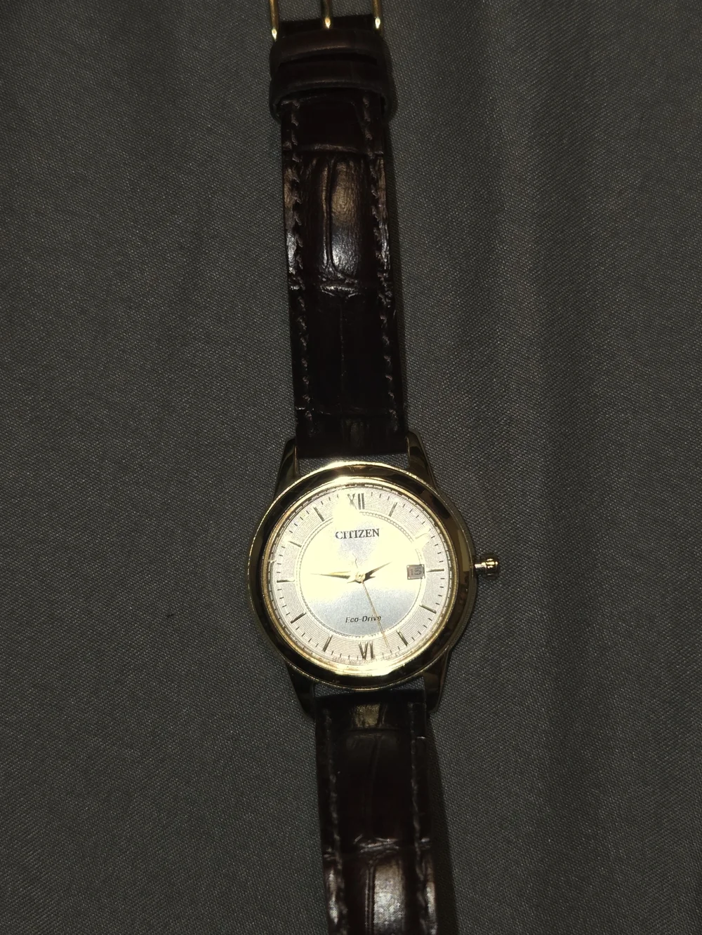 Citizen Gold Tone Case Watch with Brown Strap.